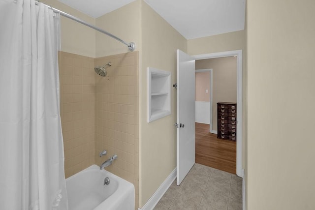 530 Powers Ln, Decatur, IL 62522 - bathroom featuring shower / bath combination with curtain and tile patterned floors
