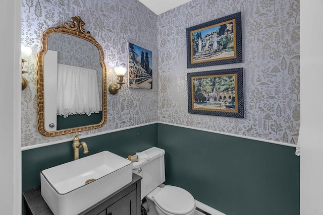 530 Powers Ln, Decatur, IL 62522 - half bathroom featuring wallpapered walls and wainscoting