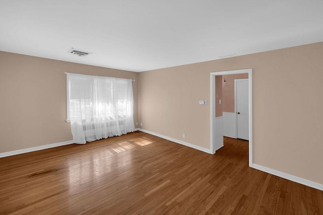 530 Powers Ln, Decatur, IL 62522 - empty room featuring baseboards and wood finished floors
