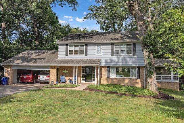 530 Powers Ln, Decatur, IL 62522 - view of front facade featuring brick siding, a garage, a front yard, driveway, and a shingled roof
