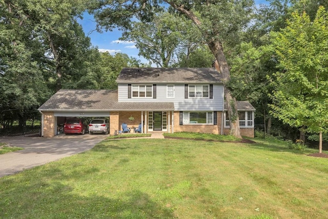 530 Powers Ln, Decatur, IL 62522 - view of front of home featuring concrete driveway, brick siding, and a front lawn