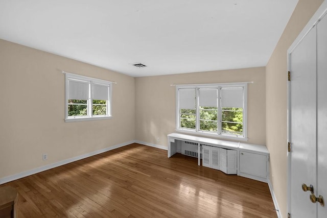 530 Powers Ln, Decatur, IL 62522 - unfurnished bedroom featuring hardwood / wood-style flooring and baseboards