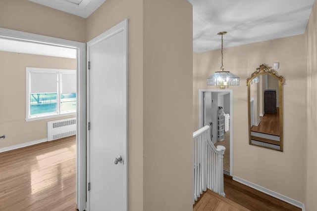 530 Powers Ln, Decatur, IL 62522 - hall featuring radiator, an upstairs landing, and wood finished floors