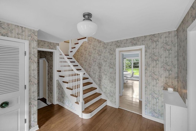 530 Powers Ln, Decatur, IL 62522 - staircase with hardwood / wood-style flooring, wallpapered walls, and crown molding