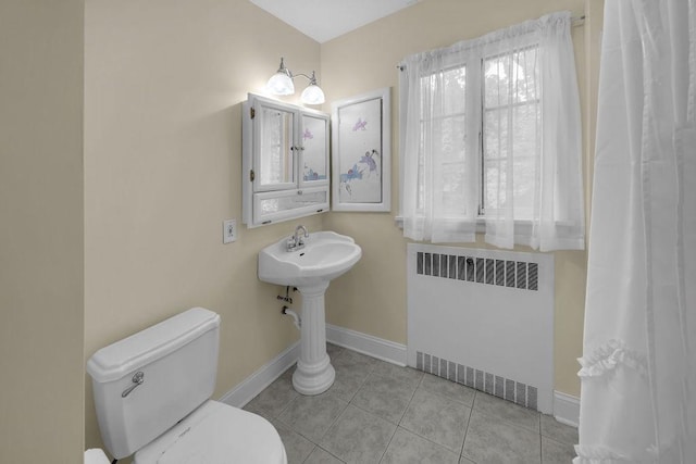 530 Powers Ln, Decatur, IL 62522 - bathroom featuring radiator and tile patterned flooring