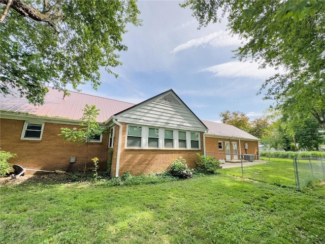 201 N York St, Martinsville, IL 62442 - rear view of property with brick siding and metal roof