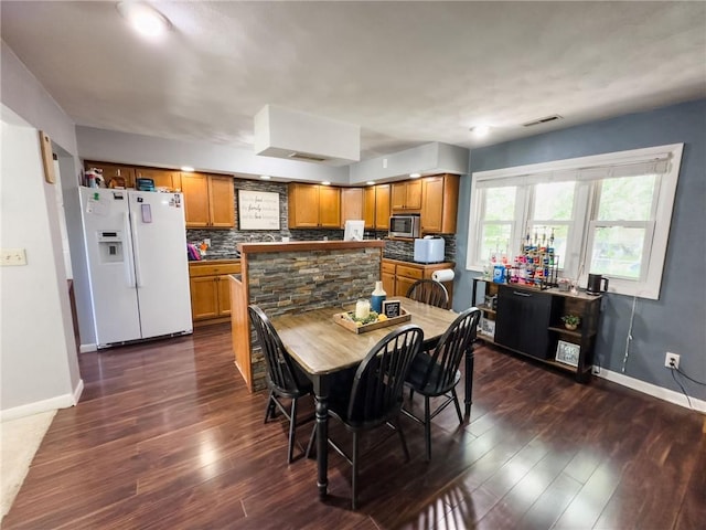 201 N York St, Martinsville, IL 62442 - dining space featuring baseboards and dark wood-style floors