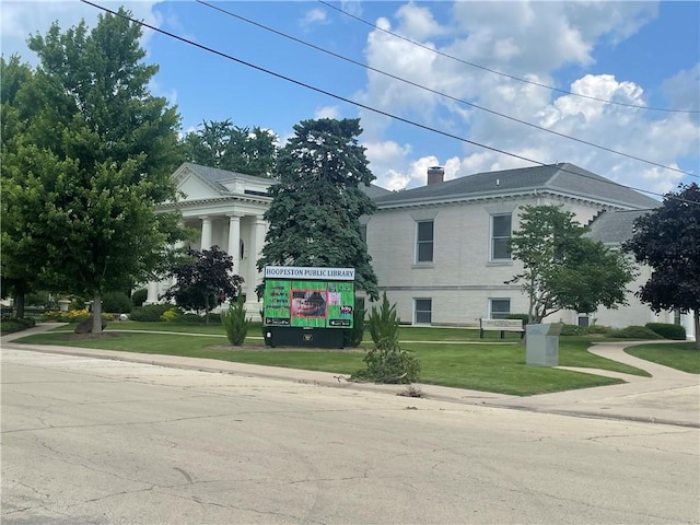 428 E Main St, Hoopeston, IL 60942 - view of side of property featuring a yard and a chimney