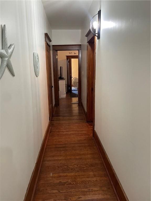 428 E Main St, Hoopeston, IL 60942 - hallway with dark wood-style flooring and baseboards