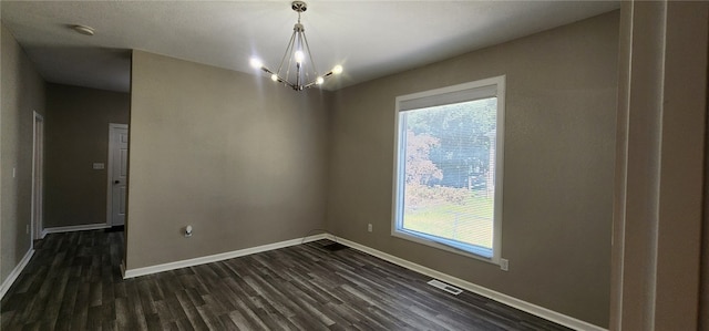 1420 E Main St, Decatur, IL 62521 - empty room with dark wood-type flooring, healthy amount of natural light, and a smoke detector