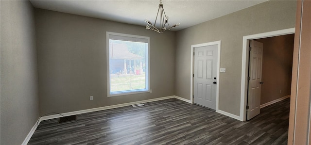 1420 E Main St, Decatur, IL 62521 - unfurnished room featuring a chandelier and dark wood-type flooring