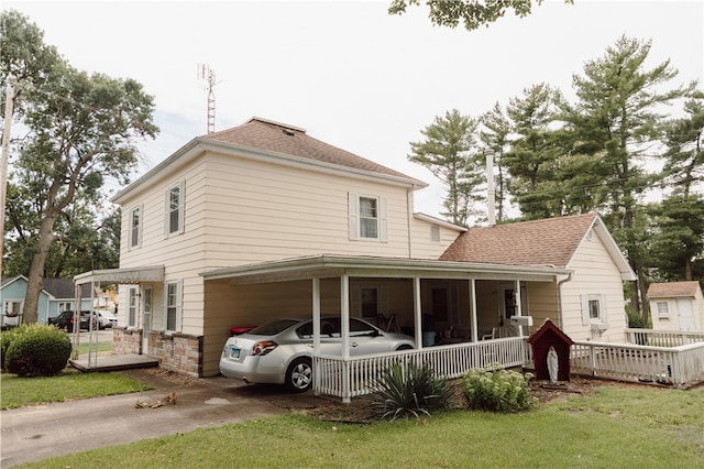 125 College St, Assumption, IL 62510 - back of house with a yard and a shingled roof