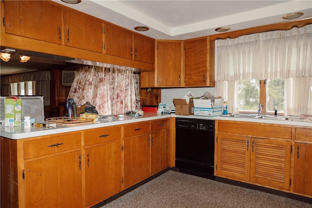 kitchen featuring dark colored carpet, black dishwasher, a tray ceiling, and sink