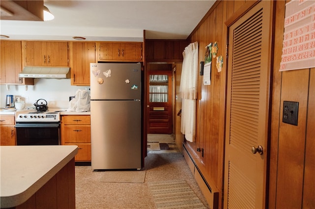 kitchen featuring stainless steel fridge, a baseboard heating unit, and electric range oven