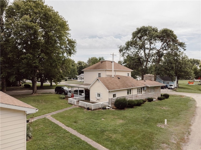 125 College St, Assumption, IL 62510 - view of side of home with a yard and a chimney