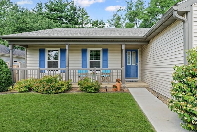 2506 Woodlawn Dr, Charleston, IL 61920 - view of front of property featuring covered porch, a front yard, and roof with shingles