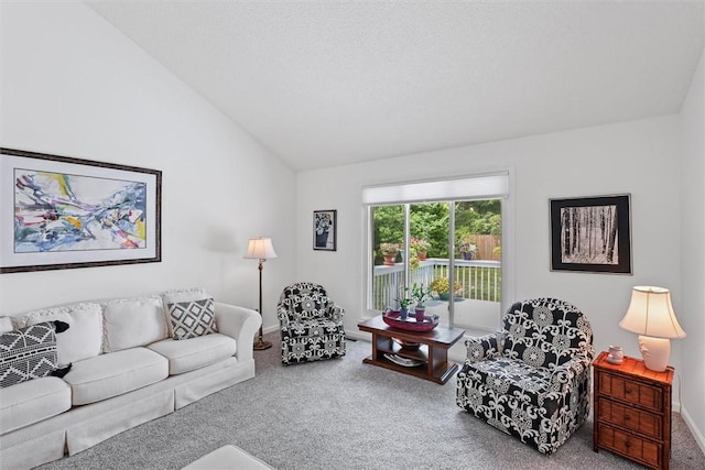 2506 Woodlawn Dr, Charleston, IL 61920 - carpeted living room with lofted ceiling and baseboards