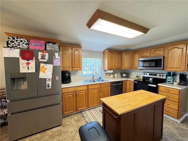 202 Seminary St, Catlin, IL 61817 - kitchen with stainless steel appliances, butcher block countertops, a kitchen island, and brown cabinets