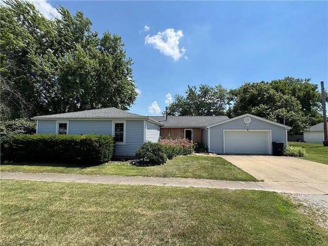 202 Seminary St, Catlin, IL 61817 - view of front facade with concrete driveway, a garage, and a front lawn