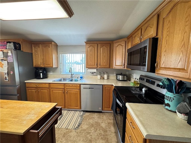 202 Seminary St, Catlin, IL 61817 - kitchen with stainless steel appliances, light countertops, and brown cabinets