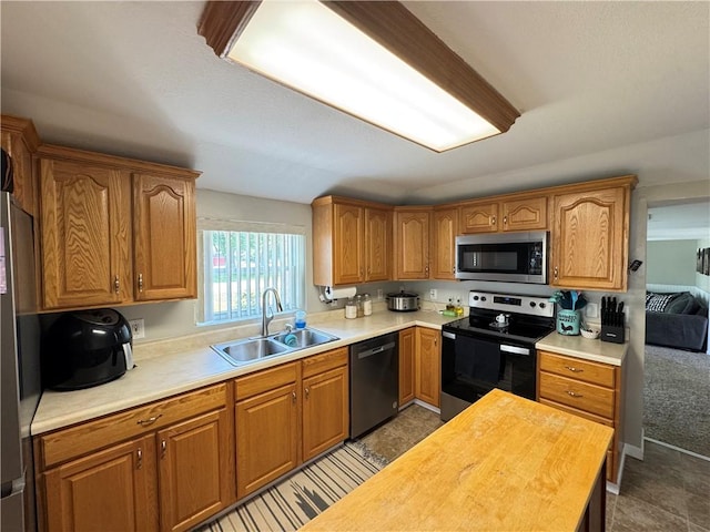 202 Seminary St, Catlin, IL 61817 - kitchen featuring stainless steel microwave, electric stove, dishwasher, brown cabinets, and wood counters