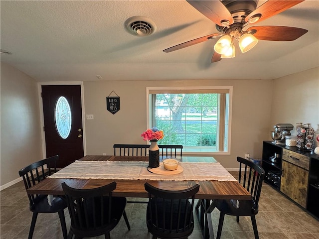 202 Seminary St, Catlin, IL 61817 - tiled dining area with a ceiling fan and a textured ceiling