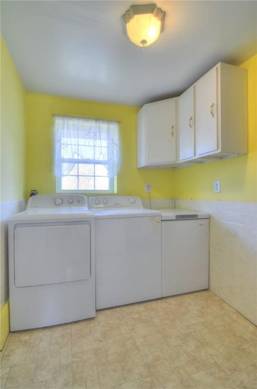 laundry room featuring cabinet space and washer and dryer