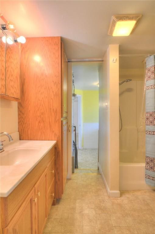 bathroom with vanity and shower / bathtub combination with curtain