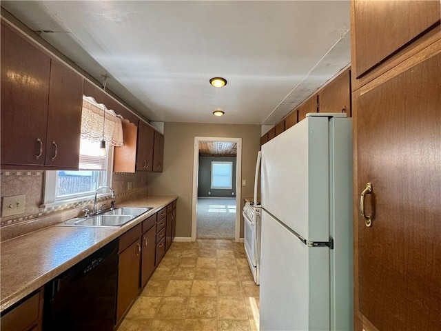 1821 Dakota Ave, Mattoon, IL 61938 - kitchen featuring white appliances, a sink, decorative backsplash, light countertops, and baseboards