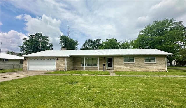 421 N 25th St, Mattoon, IL 61938 - single story home with stone siding, a garage, a chimney, metal roof, and driveway