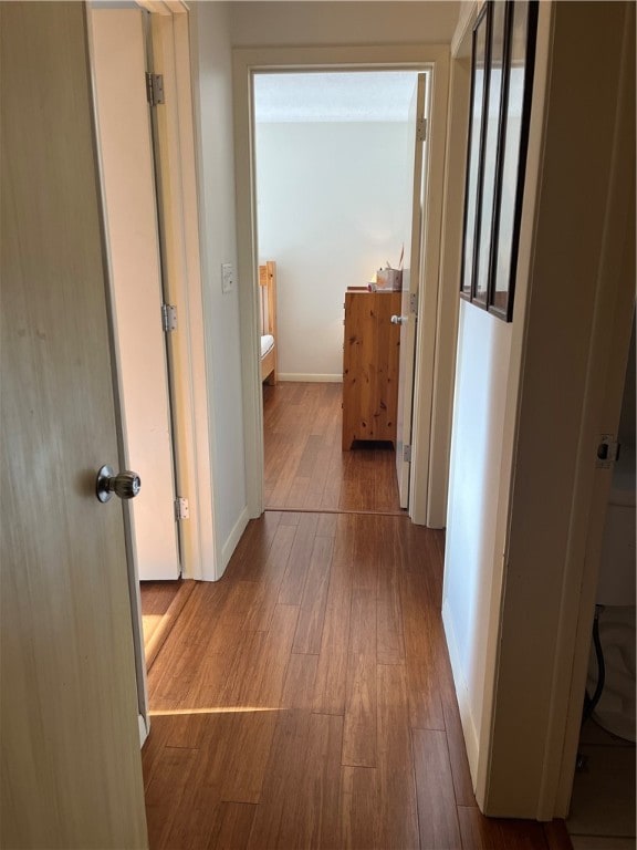 corridor featuring light hardwood / wood-style floors