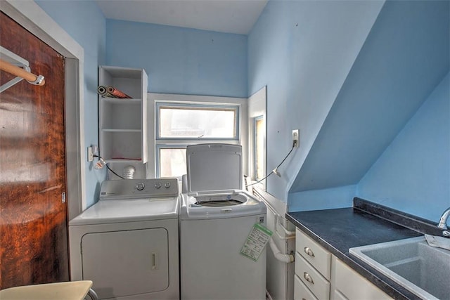 clothes washing area featuring sink and separate washer and dryer