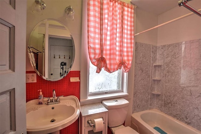 full bathroom featuring sink, toilet, and shower / tub combo with curtain