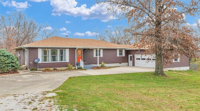 ranch-style house with a garage and a front lawn