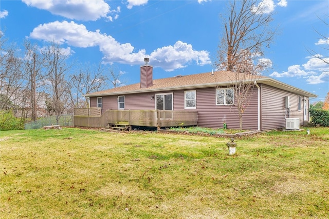 back of house featuring a wooden deck, a yard, and cooling unit