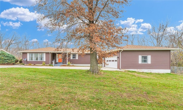 ranch-style home with a front yard and a garage