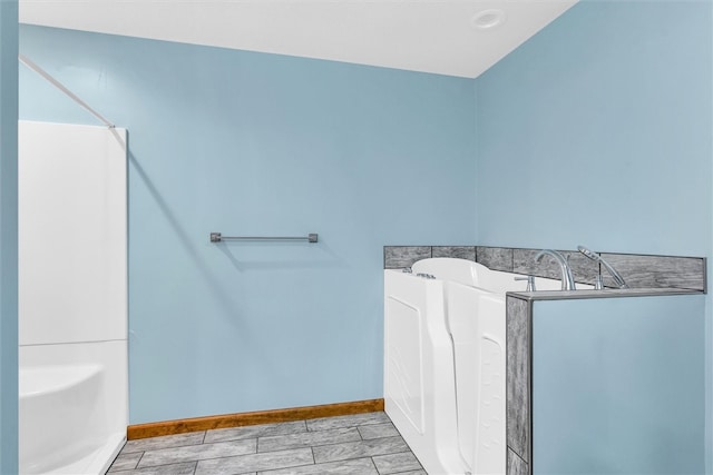 bathroom featuring a washtub