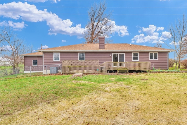 back of house with a lawn, cooling unit, and a wooden deck