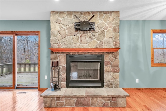 details featuring a fireplace and hardwood / wood-style floors