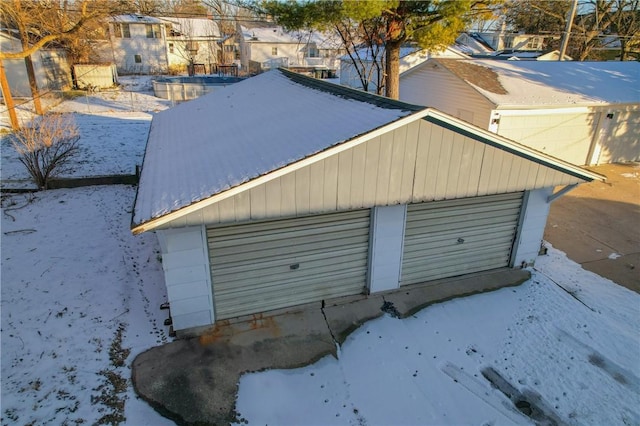 view of snow covered garage