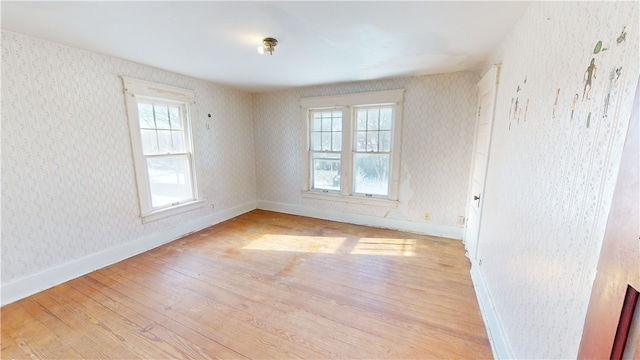 spare room featuring light hardwood / wood-style flooring