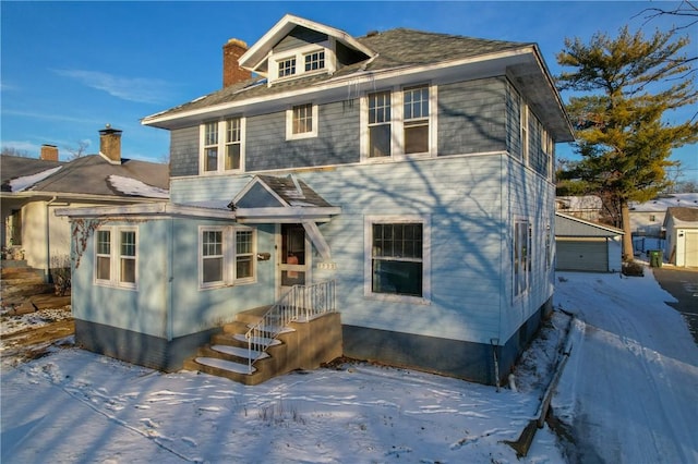 view of front of house with an outbuilding and a garage