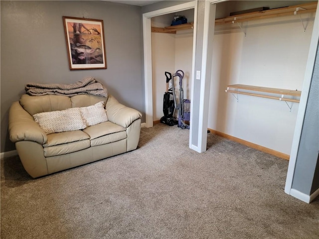living room with carpet and baseboards