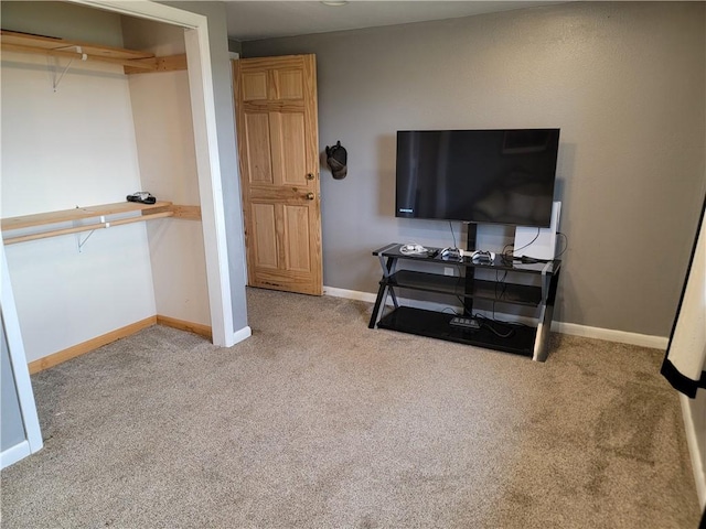 bedroom with carpet flooring and baseboards