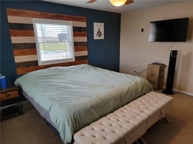 bedroom with baseboards, carpet floors, and ceiling fan