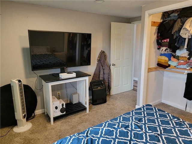 carpeted bedroom featuring baseboards