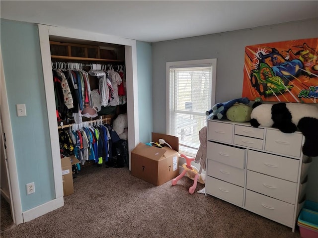 carpeted bedroom featuring a closet