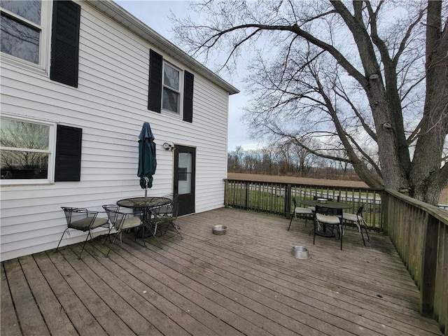 wooden deck with outdoor dining space