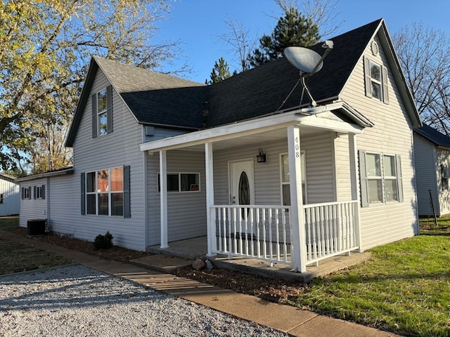 view of front of property with central AC unit and a porch