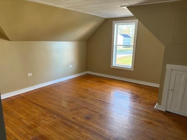 bonus room featuring hardwood / wood-style floors and vaulted ceiling